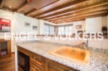 This stunning property boasts a beautiful kitchen with granite countertops and wooden cabinetry.