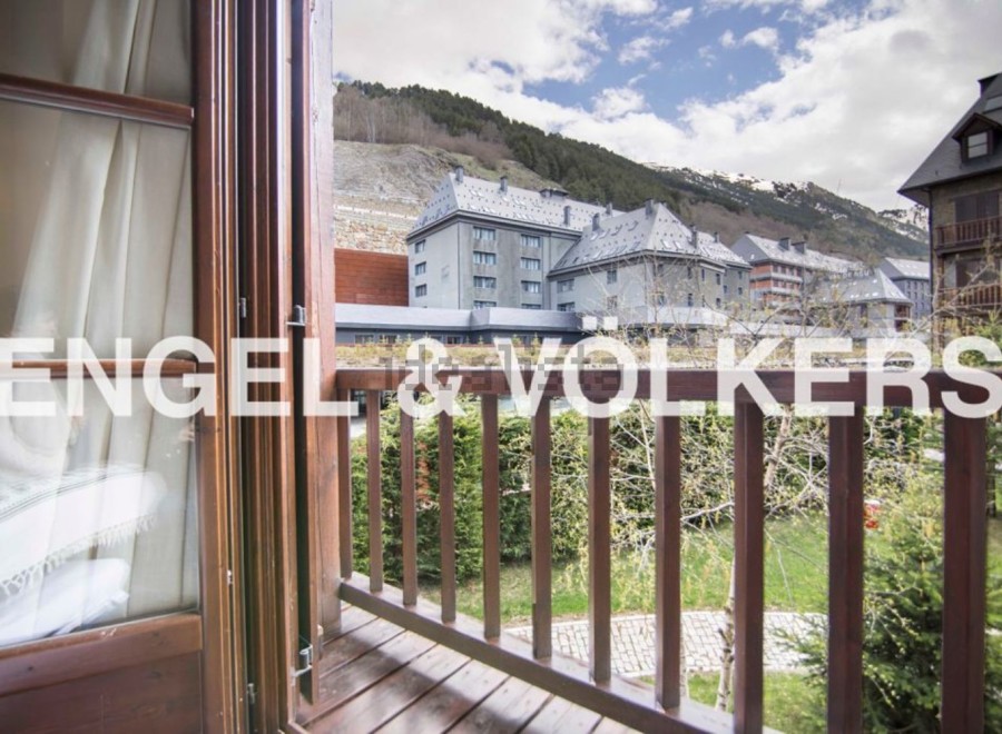 This stunning property boasts a private balcony with breathtaking mountain views.