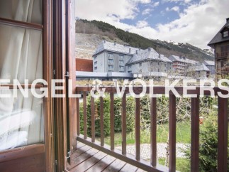 This stunning property boasts a private balcony with breathtaking mountain views.