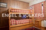 Cozy bunk beds in a charming wooden room, perfect for a family getaway.