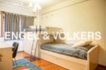 Charming children's bedroom with built-in bunk beds and trundle, perfect for sleepovers or siblings.
