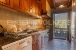 Charming kitchen with wooden cabinets and granite countertops.