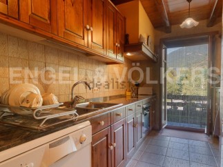 Charming kitchen with wooden cabinets and granite countertops.
