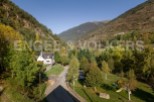 Nestled in a picturesque valley, this charming house offers breathtaking mountain views.