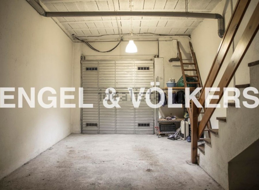 Spacious garage with ample storage space, perfect for parking and additional storage needs.