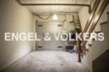 Spacious garage with ample storage space, perfect for parking and additional storage needs.
