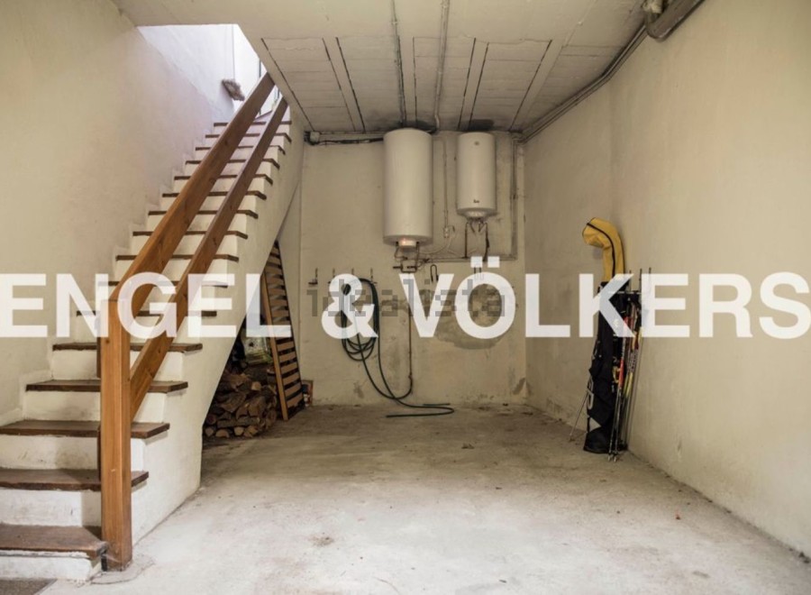This spacious basement offers ample storage solutions, including a dedicated area for firewood and additional space for various items.