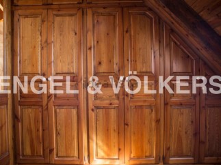 This stunning property boasts exquisite built-in wooden wardrobes, offering ample storage space.