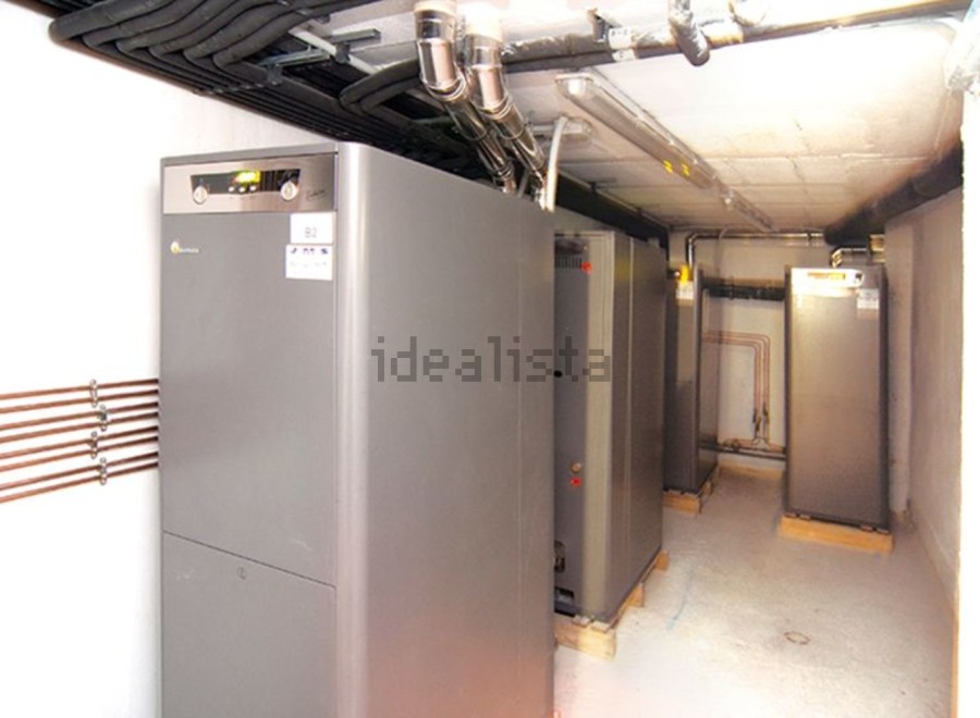 This property boasts a state-of-the-art heating system, featuring multiple high-efficiency heat pumps neatly arranged in a dedicated room.