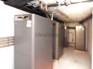 This property boasts a state-of-the-art heating system, featuring multiple high-efficiency heat pumps neatly arranged in a dedicated room.