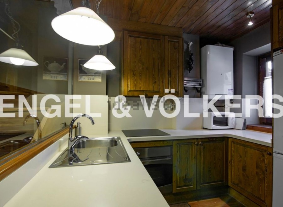 Charming kitchen with wooden cabinets and modern appliances.