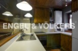 Charming kitchen with wooden cabinets and modern appliances.