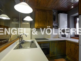 Charming kitchen with wooden cabinets and modern appliances.