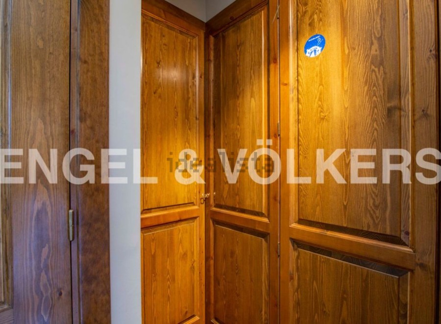 This stunning property boasts exquisite wooden cabinetry throughout, adding a touch of rustic elegance to the space.