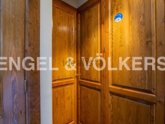 This stunning property boasts exquisite wooden cabinetry throughout, adding a touch of rustic elegance to the space.
