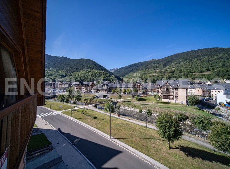This stunning property boasts breathtaking views of the Pyrenees mountains and a charming riverside setting.