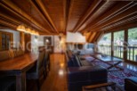This stunning chalet boasts a spacious open-plan living area with a cozy fireplace, perfect for relaxing after a day on the slopes.
