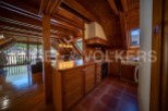 This stunning attic apartment boasts a spacious open-plan living area with large windows offering breathtaking views.
