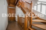 This stunning property boasts a beautiful wooden staircase, adding a touch of elegance to the home.