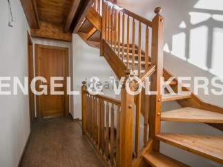 This stunning property boasts a beautiful wooden staircase, adding a touch of elegance to the home.
