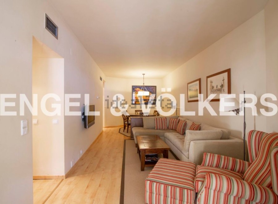 Spacious living area with hardwood floors and ample natural light.