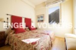Cozy bedroom with twin beds, featuring a beautiful mountain view.