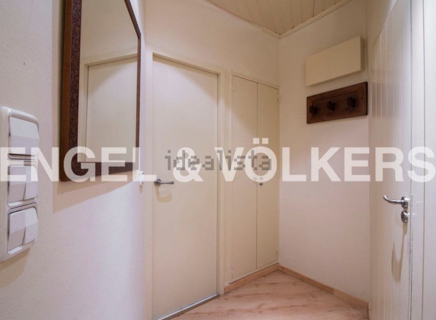 This charming hallway boasts built-in storage, offering ample space for coats and shoes.