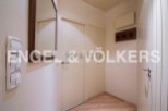 This charming hallway boasts built-in storage, offering ample space for coats and shoes.