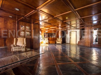 Step into luxury with this stunning property featuring exquisite wooden paneling and a grand entrance.