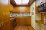 Discover this charming kitchen with its warm wooden cabinetry and inviting atmosphere.