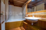 Discover a charming bathroom with a warm, inviting ambiance.