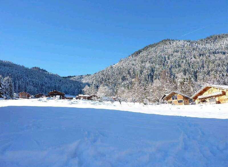 Nestled in a snow-covered mountain valley, this charming chalet offers breathtaking views and serene surroundings.