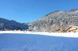 Nestled in a snow-covered mountain valley, this charming chalet offers breathtaking views and serene surroundings.
