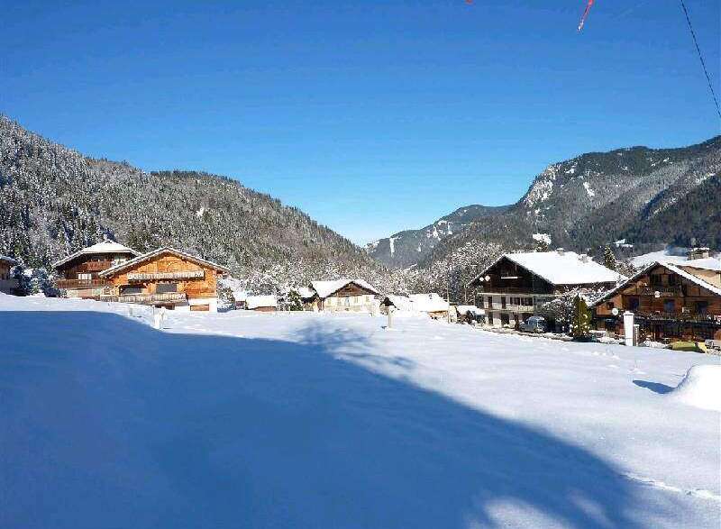 Nestled in a picturesque snow-covered valley, this charming chalet offers breathtaking mountain views.