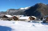 Nestled in a snow-covered mountain village, this charming chalet offers breathtaking views and a peaceful atmosphere.