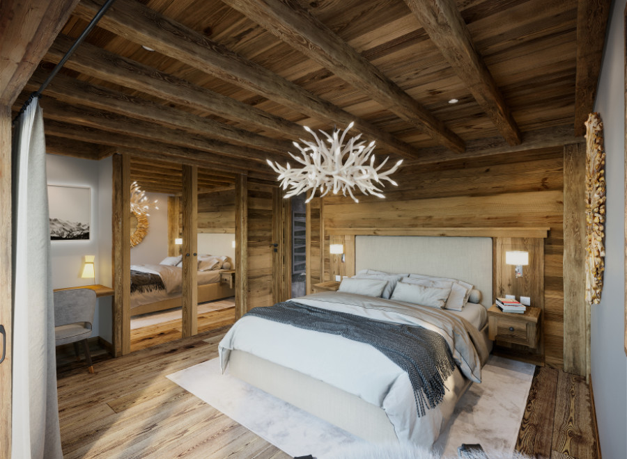 Luxurious chalet bedroom with stunning wood-beamed ceiling and antler chandelier.