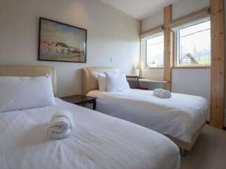 This cozy bedroom features two twin beds, perfect for guests or roommates.