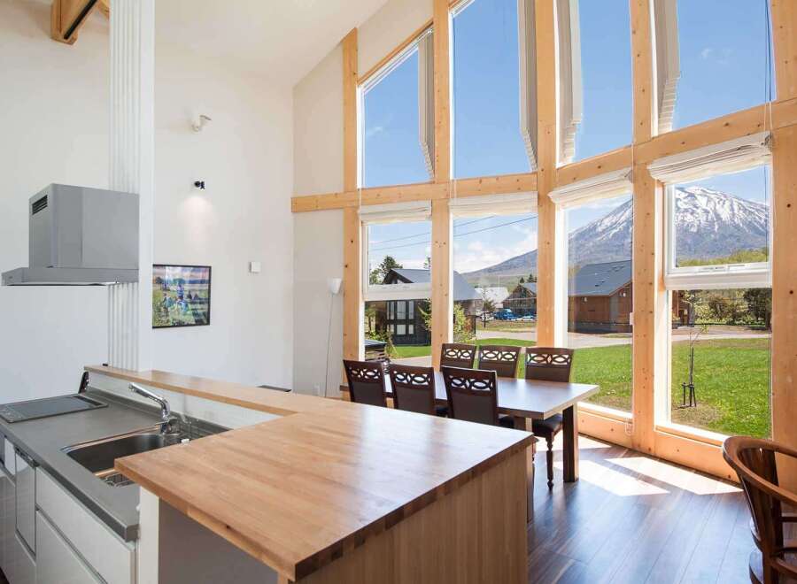 Experience the epitome of modern living in this stunning property, boasting expansive windows that frame breathtaking mountain views.