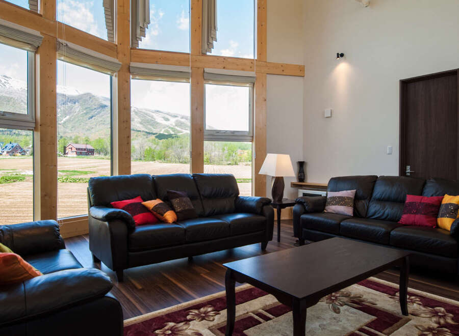 Experience the tranquility of this stunning property, featuring expansive windows that frame breathtaking mountain views.