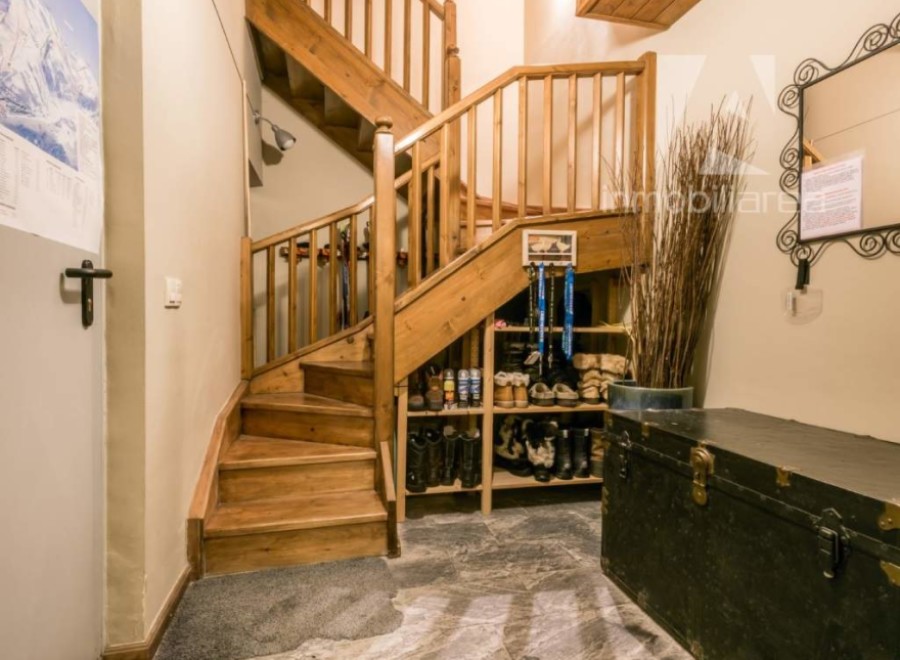 This charming property features a beautiful wooden staircase, adding warmth and character to the space.