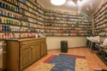 Explore this unique property featuring a remarkable collection of beer cans displayed on shelves throughout the room.