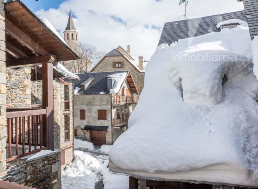 Discover the charm of this snow-covered village property.