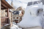 Discover the charm of this snow-covered village property.