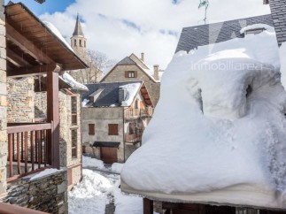 Discover the charm of this snow-covered village property.