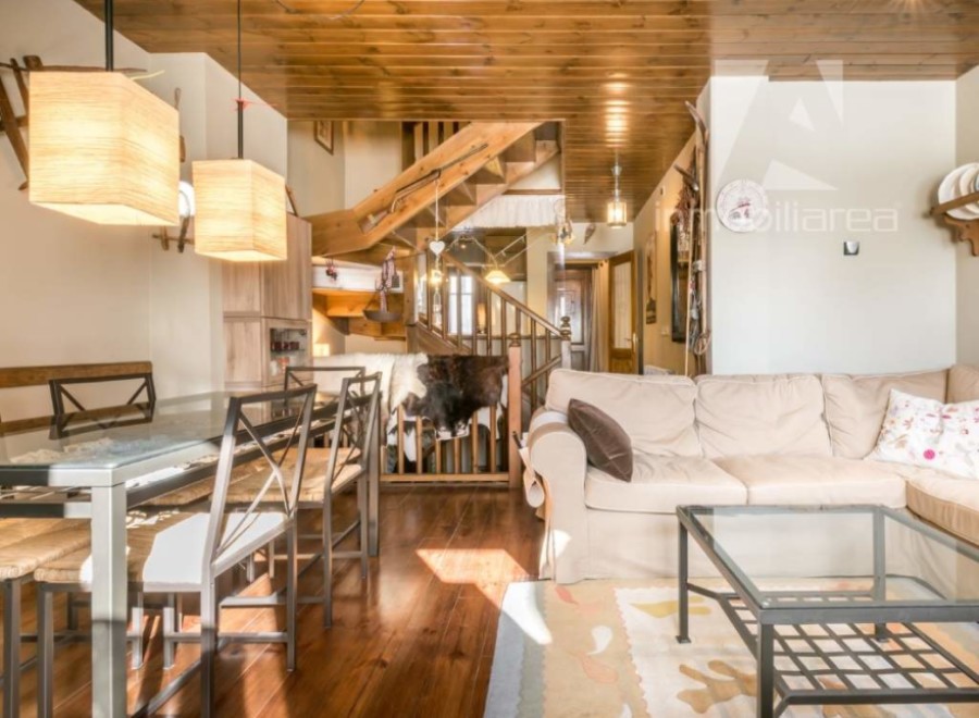 Discover this charming property featuring a cozy living space with a comfortable sofa and a stylish glass coffee table.