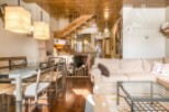 Discover this charming property featuring a cozy living space with a comfortable sofa and a stylish glass coffee table.