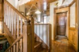 This charming property features a beautifully crafted wooden staircase, adding warmth and character to the interior.