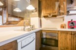 Discover the charm of this beautifully designed kitchen, featuring rustic wooden cabinetry and modern appliances.