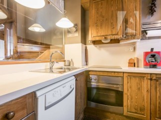 Discover the charm of this beautifully designed kitchen, featuring rustic wooden cabinetry and modern appliances.