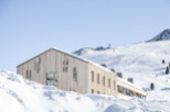 Experience the ultimate winter getaway at this stunning wooden lodge nestled in a snowy paradise.
